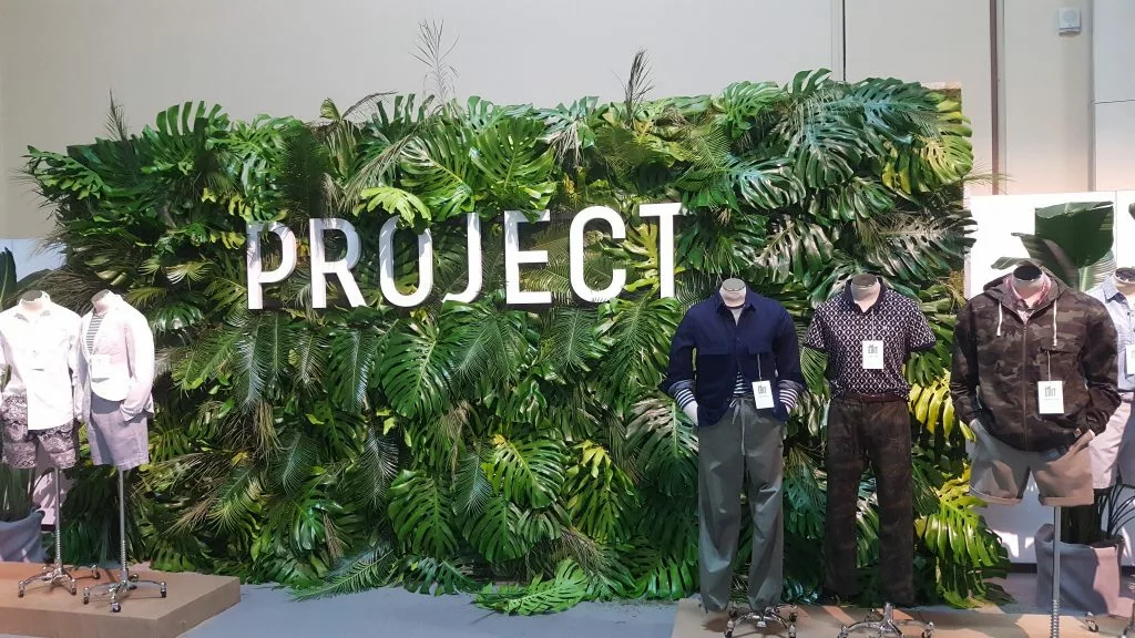 Project trade show booth living wall made with plants leaves.