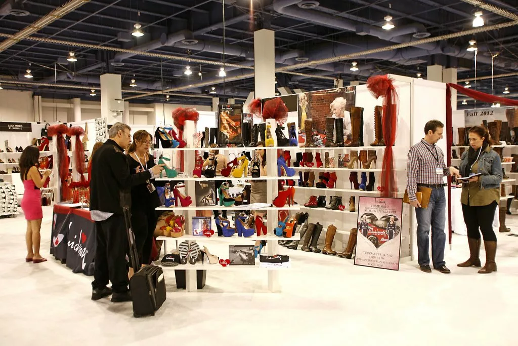 Staff at a trade show greeting visitors.