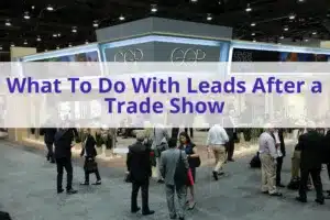 Text "What to do with leads after a trade show" with a group of people at a trade show exhibit in the background.