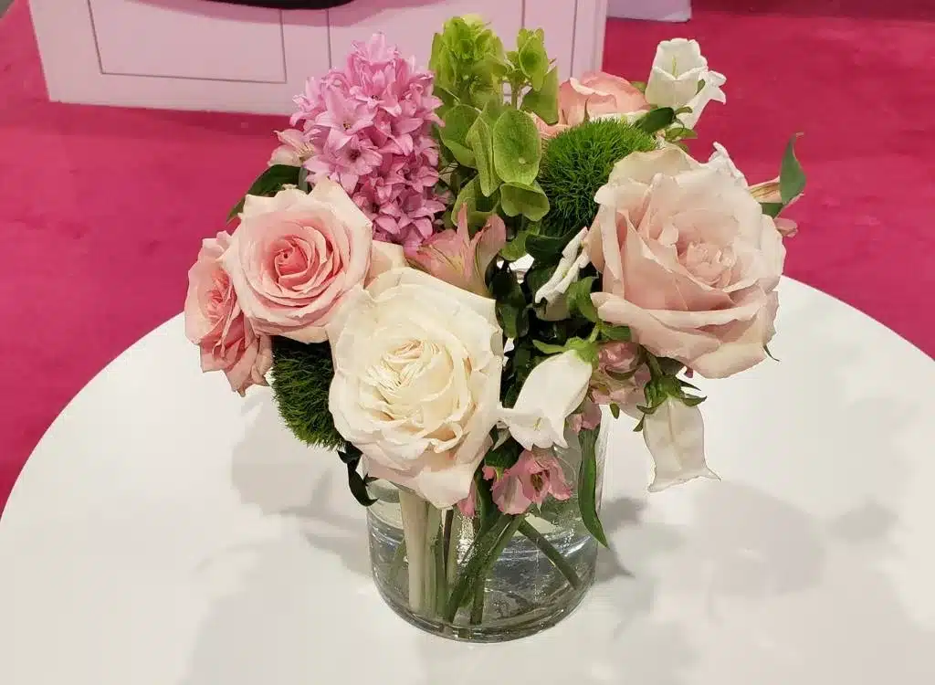 Colorful flower arrangement in a trade show booth.