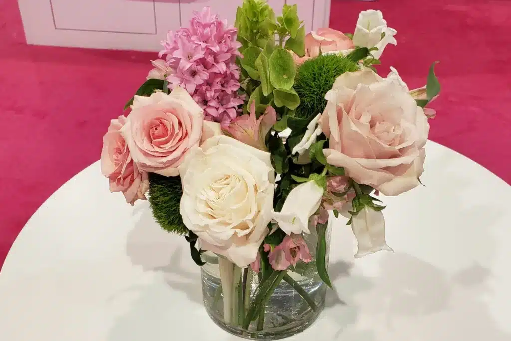 bouquet of pink and white flowers on a white table 