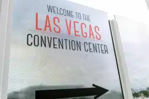sign that reads 'welcome to the las vegas convention center' with a black arrow pointing to the right