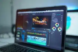 blurred photo of a laptop screen showing video editing software