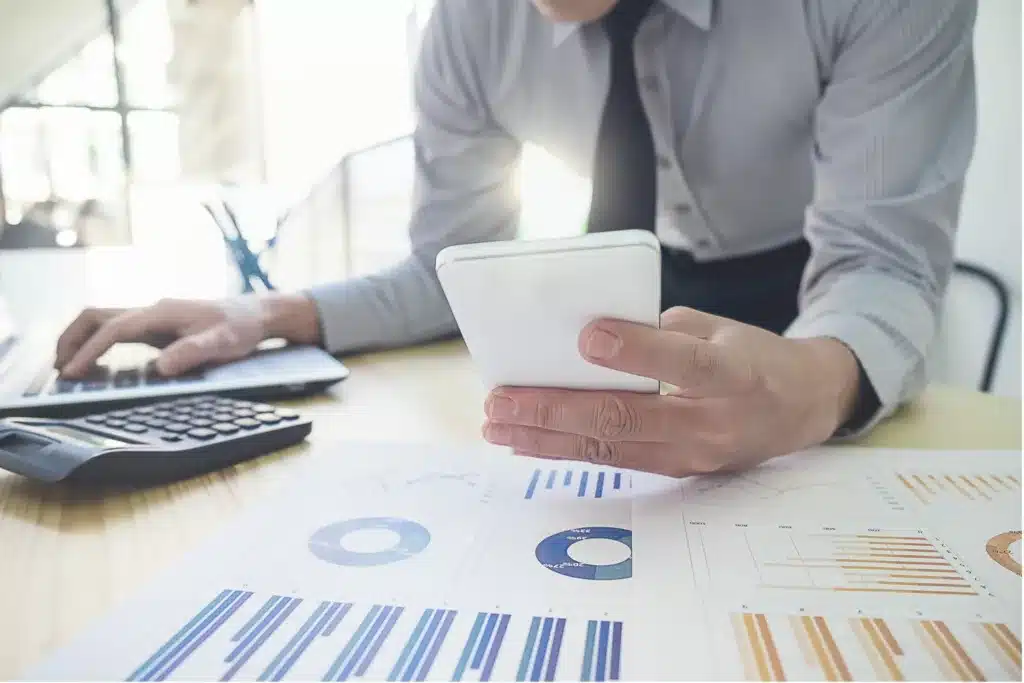 image of someone using a calculator at their desk